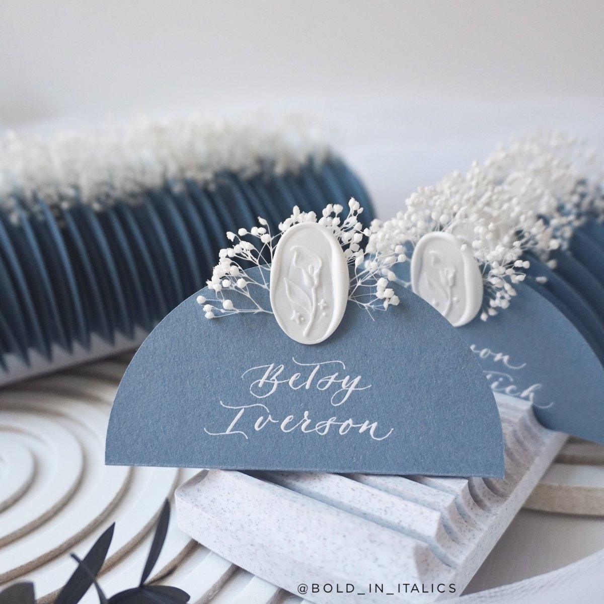 Acqua Materica calligraphy wedding place cards