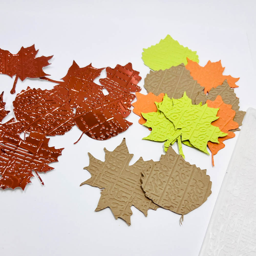embossed die cut leaves made from pistacchio, harvest, flame lessebo, and copper mirror