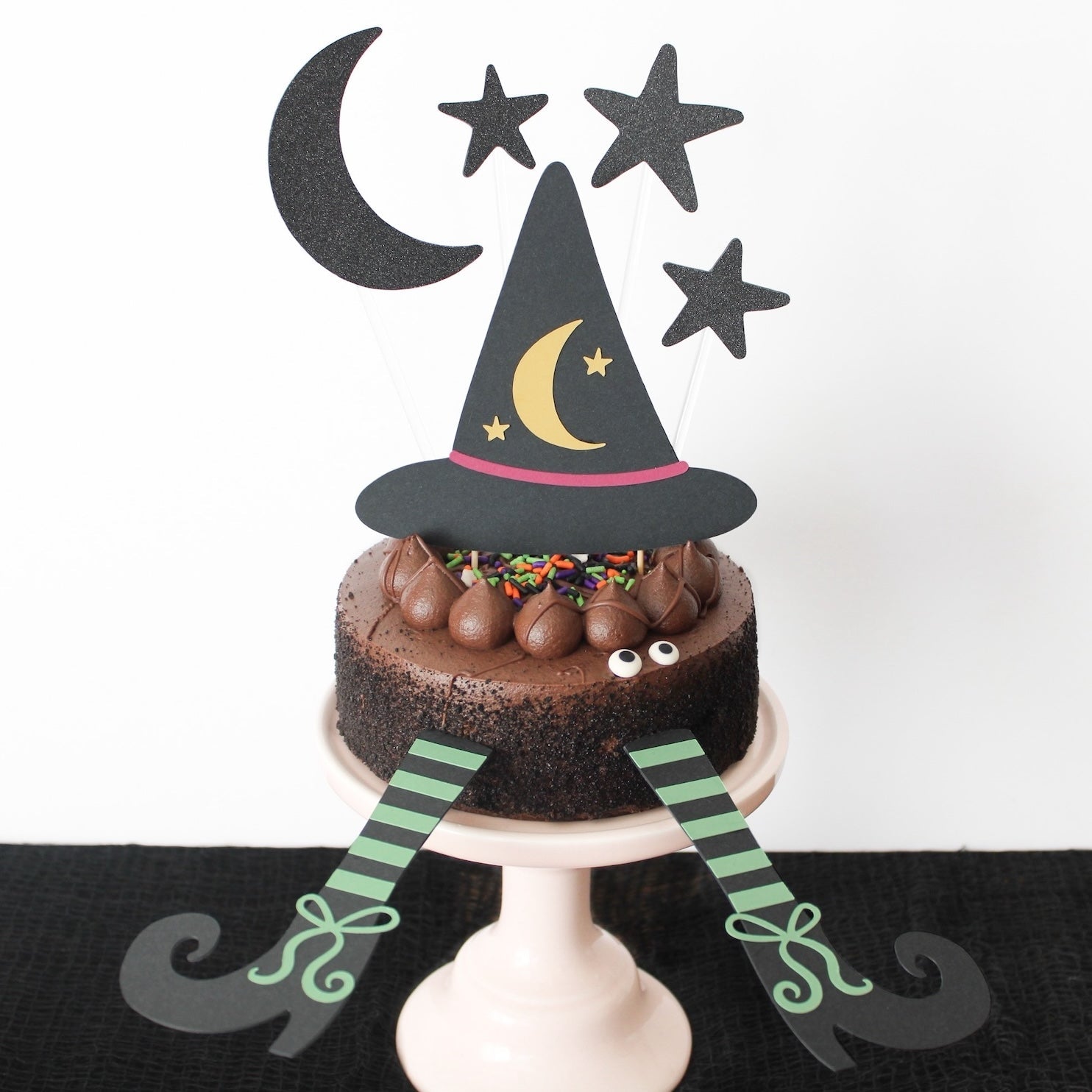 witch cake topper with Woodstock paper