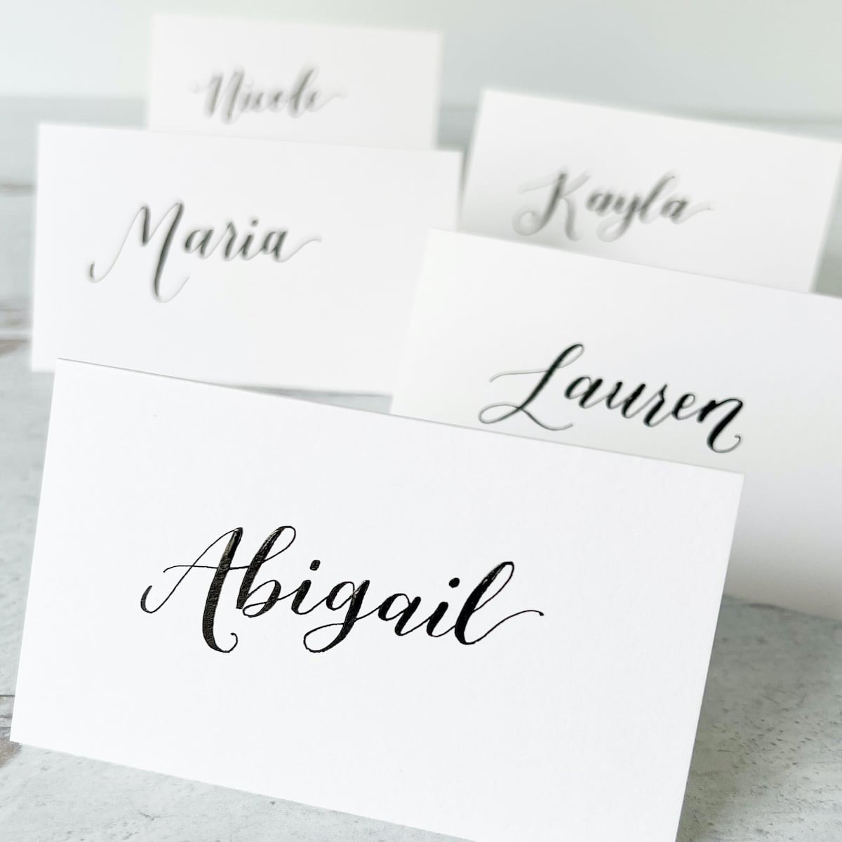 bright white calligraphy place cards