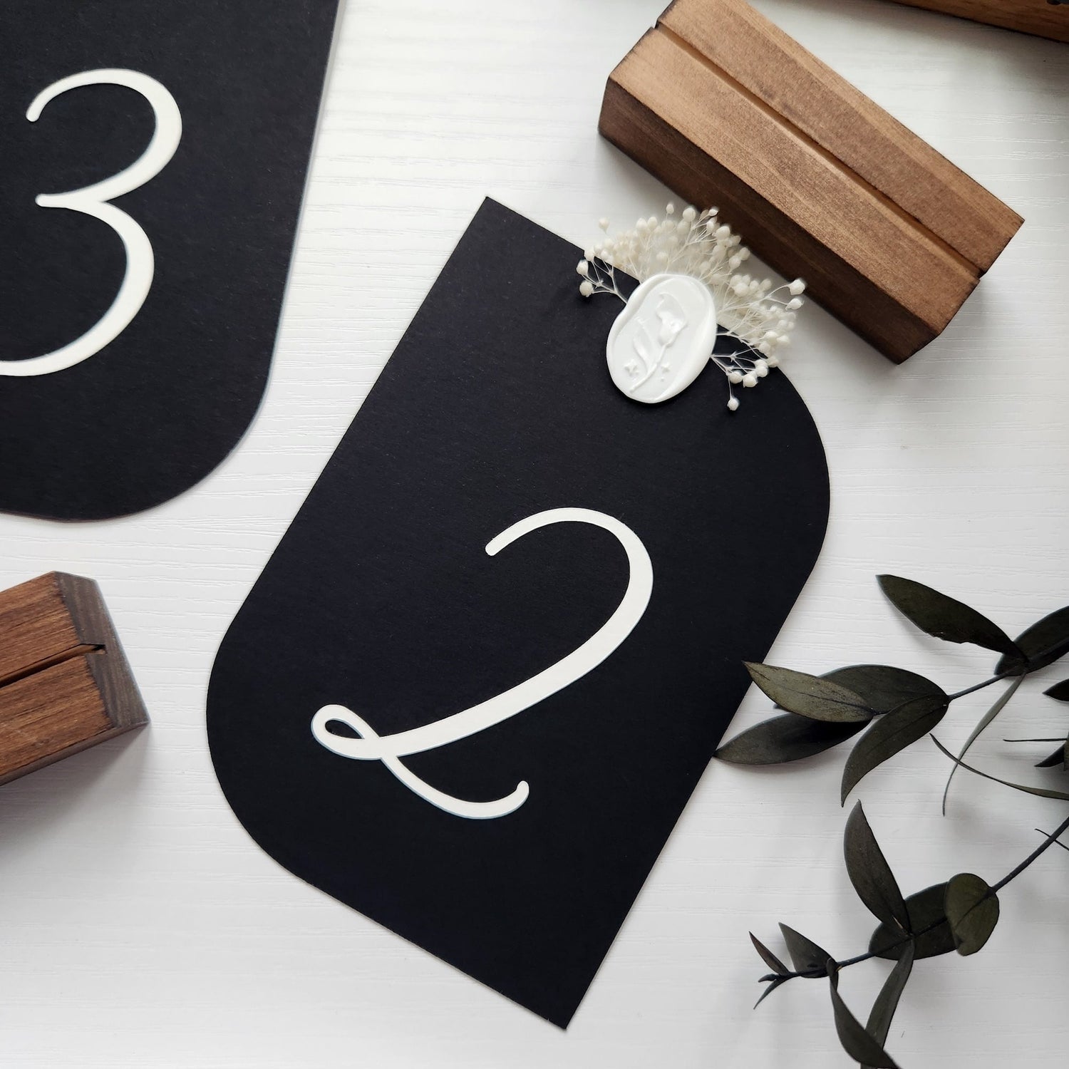 Sirio Ultra Black die cut wedding table numbers by @bold_in_italics