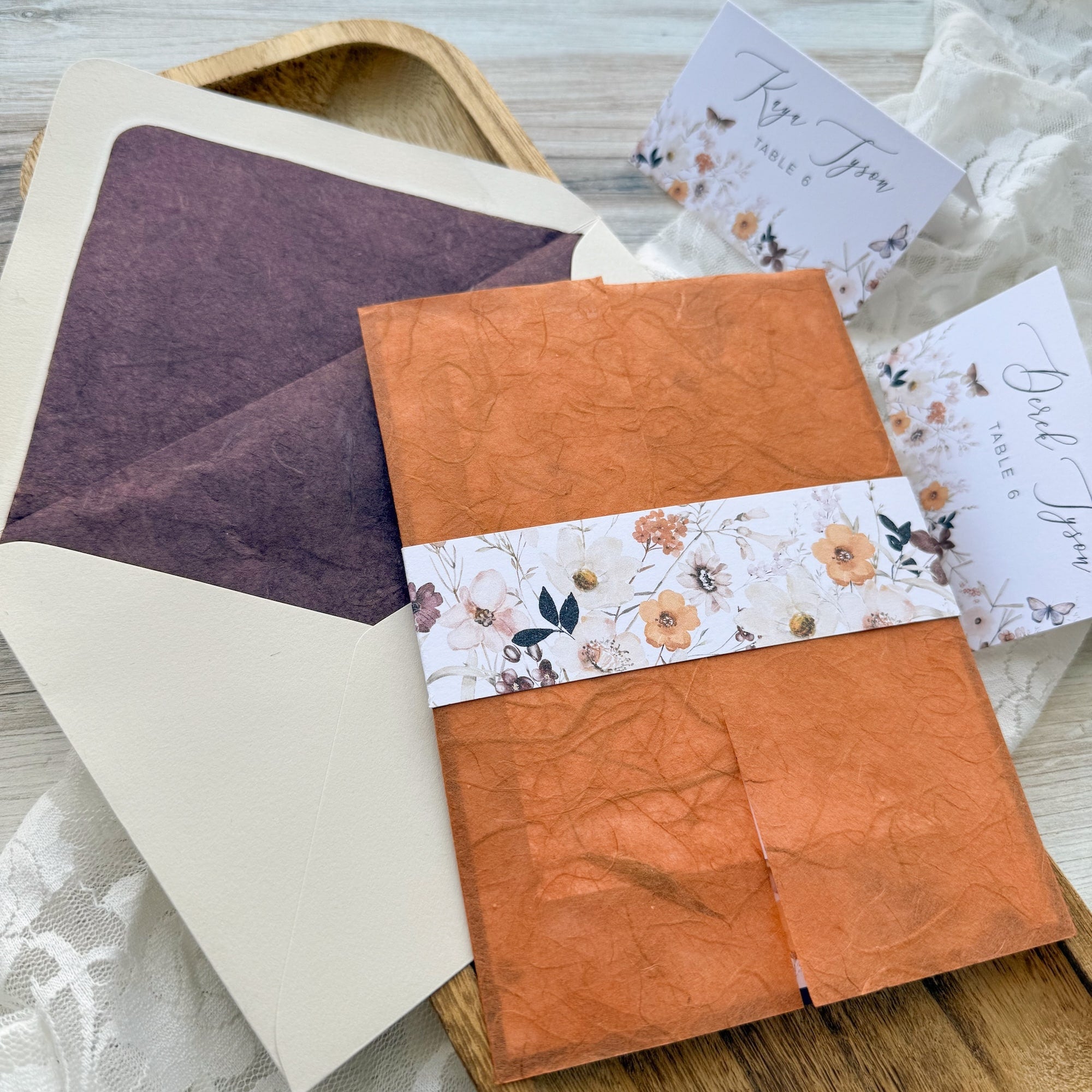 invitation with Copper Thai Unryu wrap and Plum Thai Unryu envelope liner