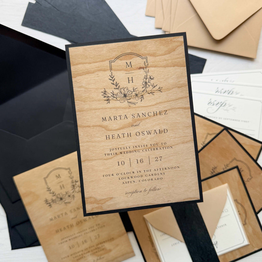 Wedding invitation with printed Wood Veneer flat cards, Madero Beach RSVP card, Black Thai Mulberry belly band, and Stone and Sirio Ultra Black envelopes